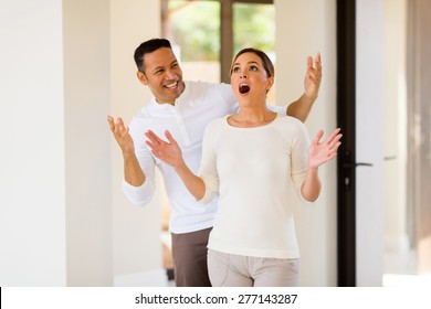 Happy Mid Age Man Surprising His Wife With A New House