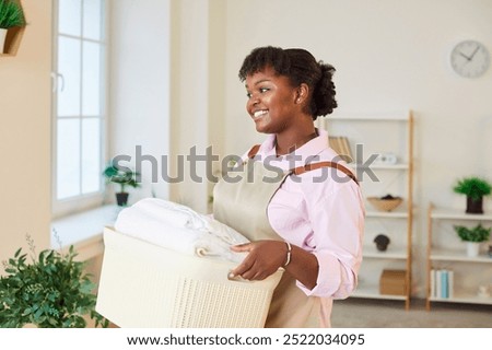 Similar – Image, Stock Photo Fabric softener | black and yellow laundry wafting fragrant in alleyway