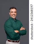 Happy middle aged business man entrepreneur, smiling mature professional confident businessman leader investor wearing green shirt standing arms crossed isolated on gray. Vertical portrait.