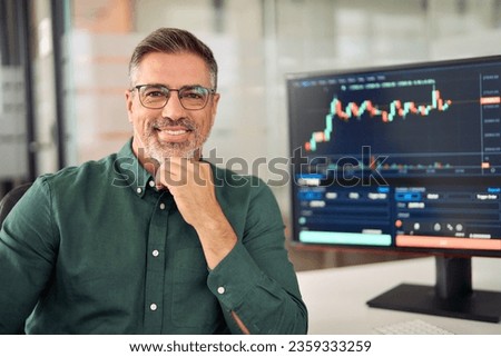 Happy middle aged business man stock investor or broker, smiling mature trader or financial expert advisor at work, stockbroker portrait. Digital trade finance exchange assets investment management.