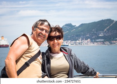 Happy Middle Aged Couple Enjoying Summer Boat Trip.