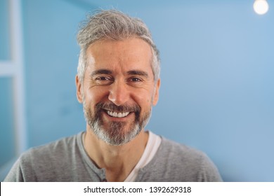 Happy Middle Aged Gray Haired Bearded Man Smiling