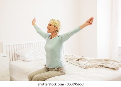 Happy Middle Aged Woman Getting Up