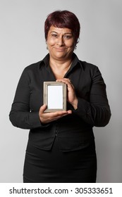 Happy Middle Aged Woman Holding Photo Frame