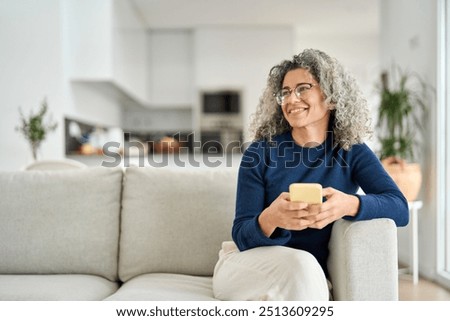 Similar – Image, Stock Photo Hand of a mature woman holding a cup of coffee.