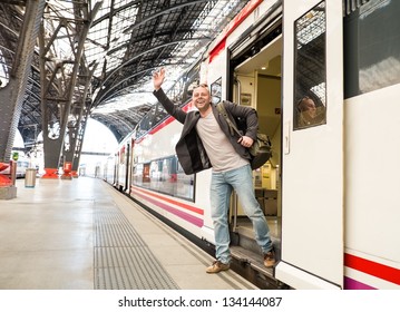 Happy Middle-aged Traveler Meeting Someone On Train Station Platform