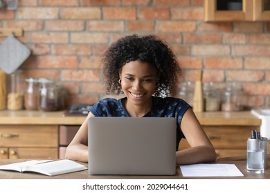 Happy Millennial Afro American Remote Employee Working At Laptop From Home, Chatting Online, Making Video Call To Client. Black Distance Student Girl Watching Learning Webinar, Virtual Training