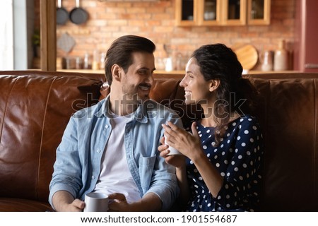 Similar – Image, Stock Photo Side view of loving couple looking at each other