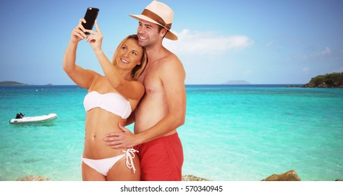 Happy Millennial Couple Taking Selfies By The Beach