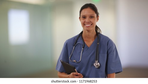 Happy millennial female nurse or doctor smiling at camera in hospital - Shutterstock ID 1171968253