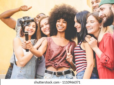 Happy Millennials Friends Making Video Feed With Smartphone Outdoor - Young People Having Fun With New Technology Trends - Youth Lifestyle And Social Media Concept - Focus On Black African Girl Face