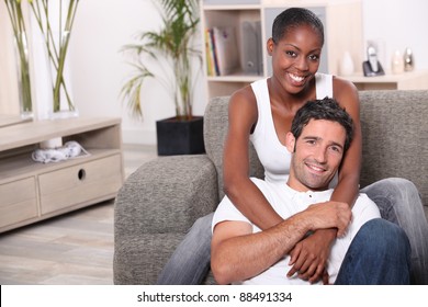 Happy Mixed Couple At Home