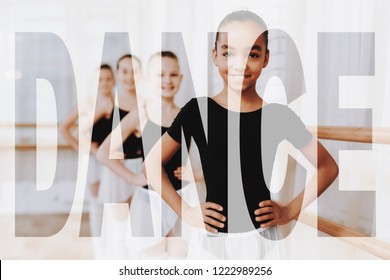 Happy Mixed Race Children In A Dance Studio. Adorable Little Girls Look At You. Ballerinas Practicing Ballet At Class. Ballet Barre Exercises. Kids In Bright Dance Room. Concept Of A Beautiful Dance.