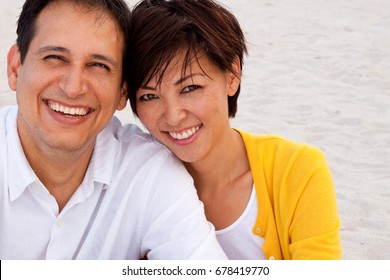 Happy Mixed Race Couple Laughing And Talking.