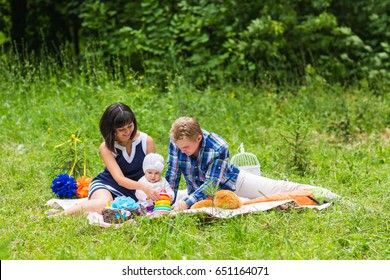 Happy Mixed Race Family Having Picnic Stock Photo (Edit Now) 651164131