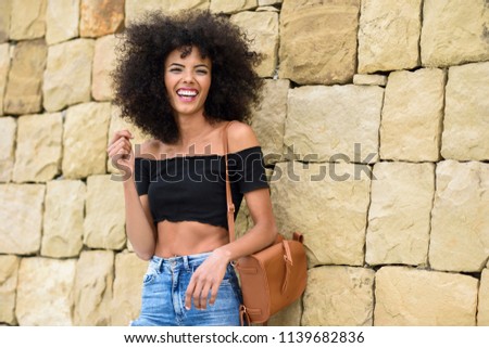 Similar – Image, Stock Photo Happy mixed woman with curly hair standing on the street