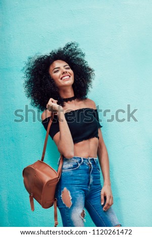 Image, Stock Photo Happy mixed woman with curly hair standing on the street