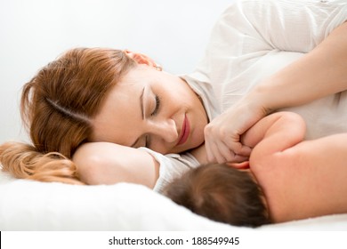 Happy Mom Breast Feeding Newborn Baby