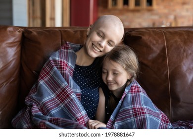 Happy Mom With Cancer And Sweet Little Kid Wrapped In Plaid Relaxing On Cozy Couch Together With Closed Eyes, Talking, Smiling, Enjoying Leisure, Comfort And Warm Moment. Oncology, Family Concept