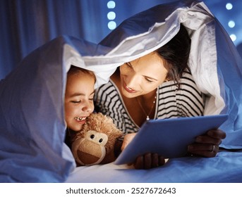 Happy mom, child and bed with tablet at night for story, online reading or ebook at home. Mother, little girl or kid with smile under duvet or sheet in bedroom for late entertainment on technology - Powered by Shutterstock