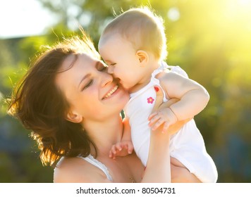 Happy Mom And Daughter Smiling At Nature