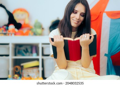 Happy Mom Reading A Book In Her Alone Tome. Smart Mother Studying For A Degree Or Getting Informed By Reading Parenting Literature 
