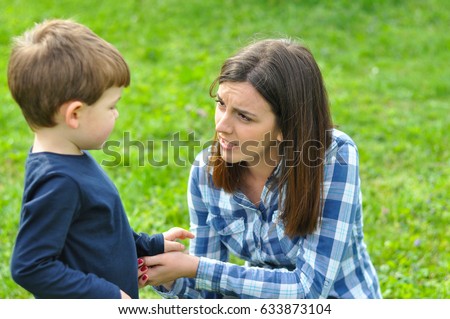 Happy Mom And Son Play In The Park In Spring Mother Talking To Her Son Happy Mom And Son Play In The Park In Spring Mother Talking To Her Son