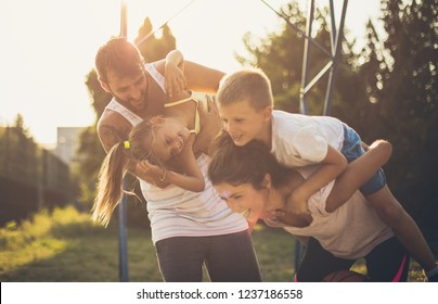  Happy Moments. Family On Playground.