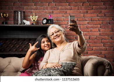 Happy moments with grandma, indian/asian senior lady spending quality time with her grand daughter 
