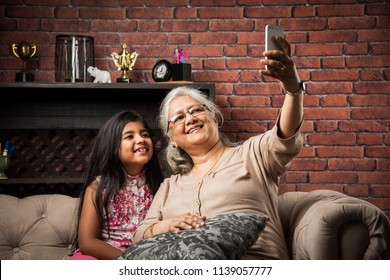 Happy moments with grandma, indian/asian senior lady spending quality time with her grand daughter 
