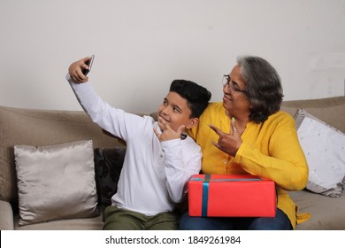 Happy Moments With Grandma, Indian/asian Senior Lady Spending Quality Time With Her Grand Son Taking Selfie.