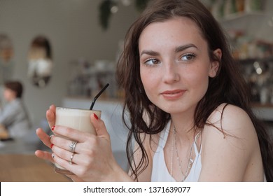 Happy morning concept. Young girl meets new day with strong coffee in hands - Powered by Shutterstock