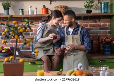 Happy morning for a perfect looking woman and man they drink the tea together at the kitchen island enjoy the breakfast they smiling large and enjoy the time together - Powered by Shutterstock