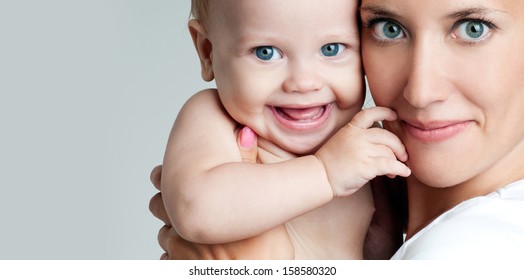 Happy Mother With Baby