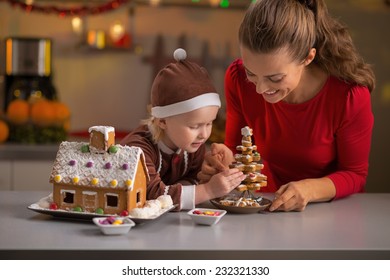 Happy Mother And Baby Making Christmas Cookie House