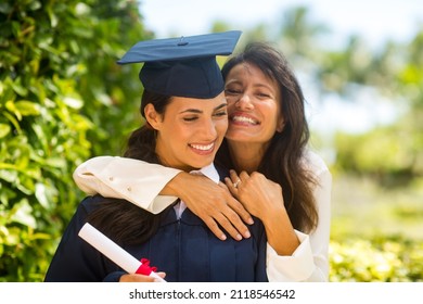 Happy mother celebrating her daughters graduation.  - Shutterstock ID 2118546542