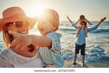 Happy mother, child and beach with family in sunset for outdoor holiday, weekend or bonding in nature. Mom, father and children playing with kids in sunshine for fun sunny day by ocean coast or sea - Powered by Shutterstock - Get 15% off with code: PIKWIZARD15
