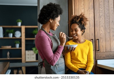 Happy mother and children in the kitchen. Healthy food, family, cooking concept - Powered by Shutterstock