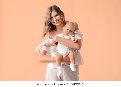 Happy Mother With Cute Little Baby On Color Background