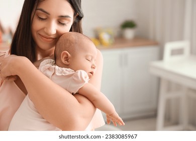 Happy mother with cute little baby in children's room - Powered by Shutterstock