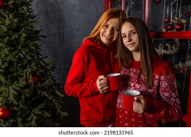 Happy Mother And Daughter Enjoying Christmas Time Together.