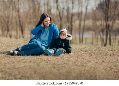 Happy Mother And Daughter Having Fun Outdoors. Mom And Toddler Spending Quality Time Outside In Nature
