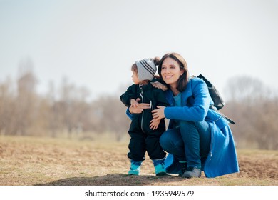 Happy Mother And Daughter Having Fun Outdoors. Mom And Toddler Spending Quality Time Outside In Nature
