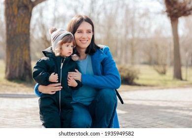 Happy Mother And Daughter Having Fun Outdoors. Mom And Toddler Spending Quality Time Outside In Nature
