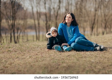 Happy Mother And Daughter Having Fun Outdoors. Mom And Toddler Spending Quality Time Outside In Nature
