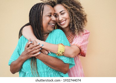 Happy mother and daughter hugging each others - Love and family concept