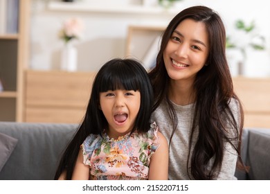 Happy Mother And Daughter Looking At Camera Sending Smile And Cheerful Face Together. Funny Happy Mom And Little Girl Having Fun Laughing Taking Poses For Self Portraits.