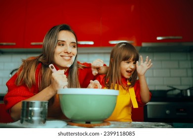 
Happy Mother and Daughter Playing with Flour in the Kitchen. Cheerful family starting a flour fight while cooking
 - Powered by Shutterstock