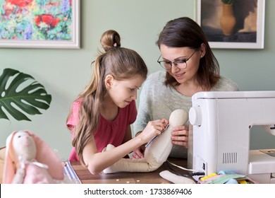 Happy Mother And Daughter Sewing Together Toy Bunny Doll At Home. Family, Hobbies And Leisure, Creativity, Lifestyle, Skills And Learning, Parent Child Communication, Mothers Day