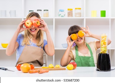 Happy mother and her daughter having fun while making smoothie together at their home. Mother and daughter making smoothie and having fun


 - Powered by Shutterstock